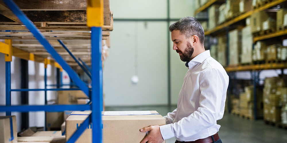 Handsome male warehouse worker or a supervisor.